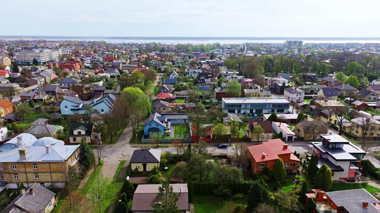 Cityscape scene from above showing coastal district of Liepaja, vivid rooftops