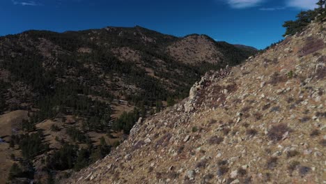 Mountain-Ridge-Highway-With-Car-Pan-Down-Aerial-Shot-4K