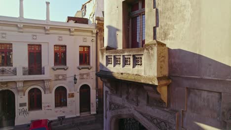 aerial detail shot on the walker palace balcony, abandoned building in concha y toro neighborhood, chile