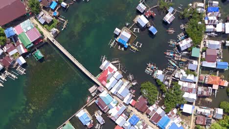 Drone-Circling-Over-Fishing-Village-in-Surigao-Del-Norte,-Philippines