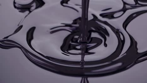 dark liquid pouring
