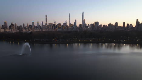 aerial view the reservoir and the central park, towards the midtown skyline, dusk in new york, usa