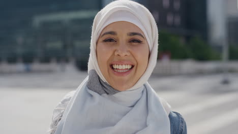 portrait young happy muslim woman smiling enjoying successful urban lifestyle independent female student wearing hijab headscarf in city real people series