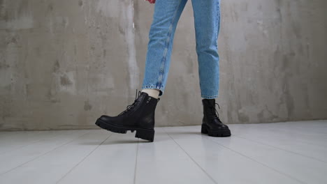 woman wearing jeans and black platform boots