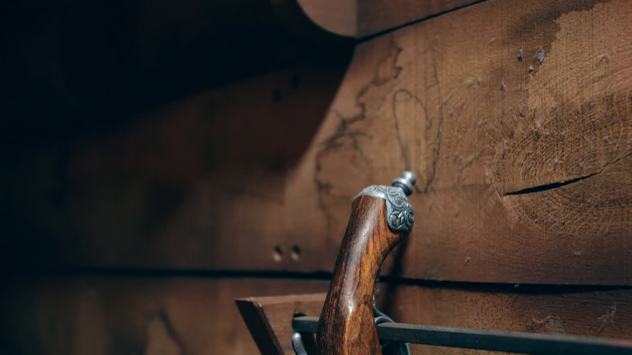 Antique Flintlock Pistol on Wooden Wall