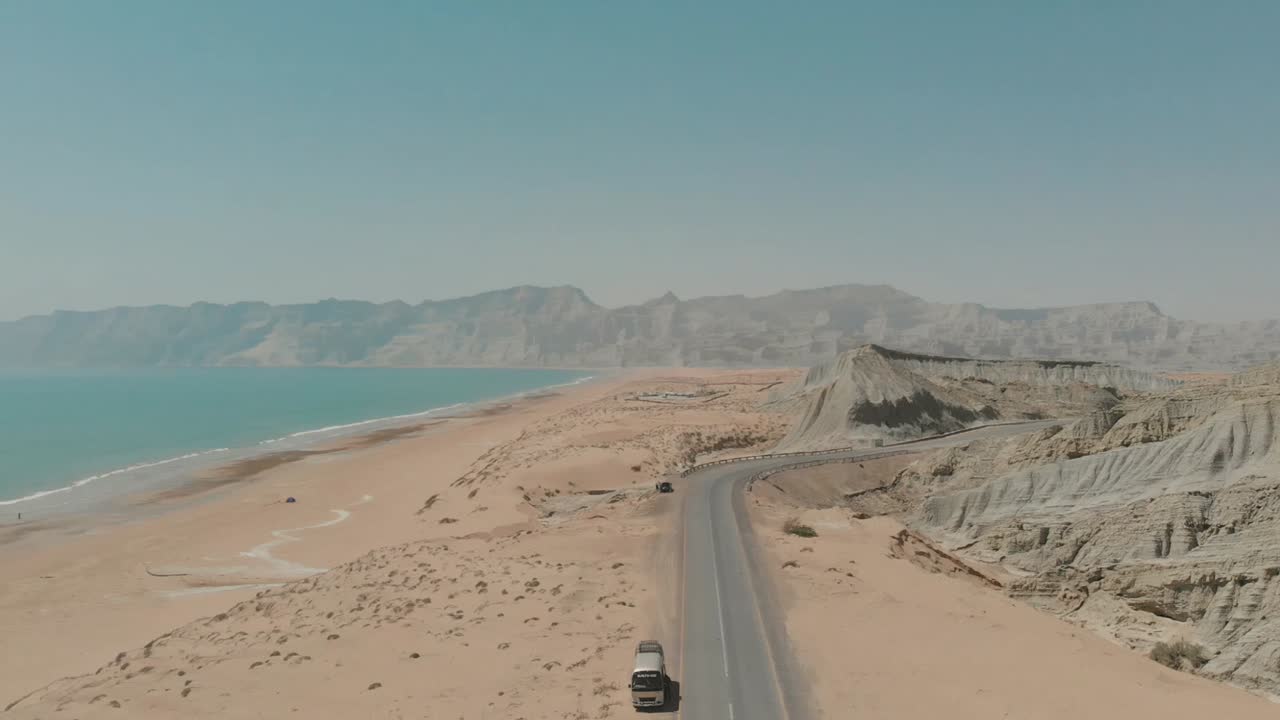 Aerial View Of Makran Coastal Highway Road Near Beach Of Gulf Of Oman. Dolly Back