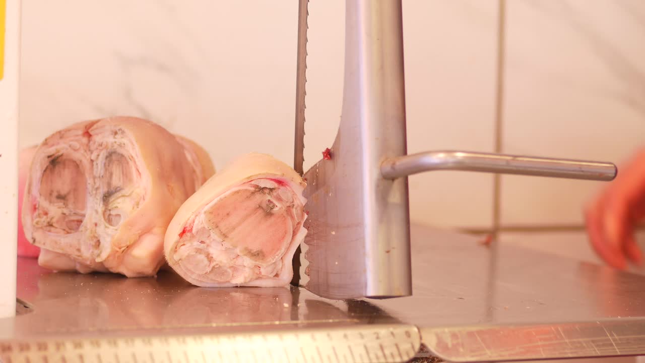 Pork Knuckle Being Sliced and/or Weighed