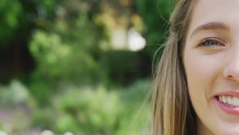 Portrait-of-happy-caucasian-woman-on-sunny-day-at-wedding