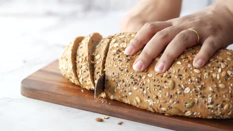 slicing multigrain bread