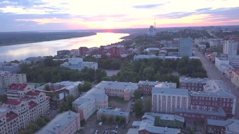 aerial view of a city at sunset with a river