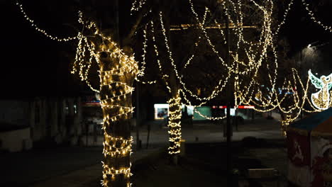 nighttime city lights with festive decorations