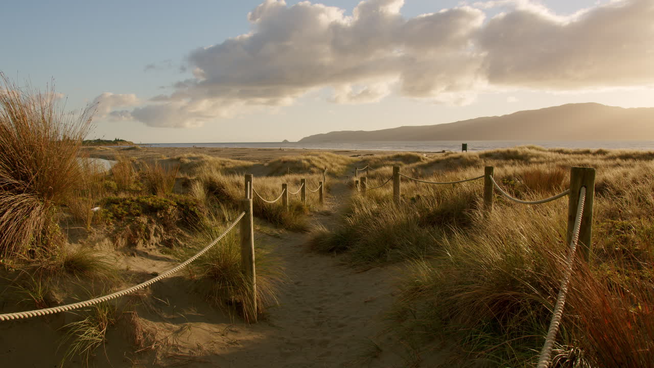 A roped path leading to the beach at sunset, Waikanae, New Zealand.