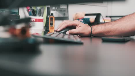 Focused-and-determined,-the-corporate-professional-scrolls-through-important-documents-at-their-office-desk,-ready-to-tackle-the-day's-tasks-with-precision-and-efficiency