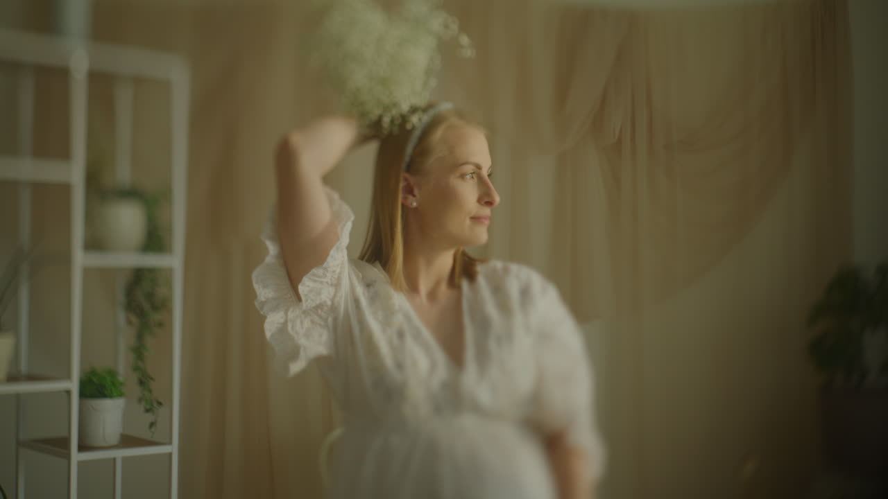 Happy Woman Holding Baby's Breath Bouquet on Head