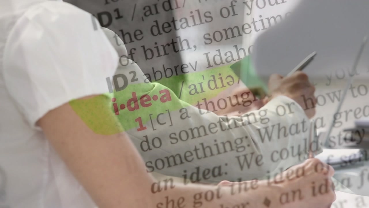 Animation of texts over diverse business people having meeting at office