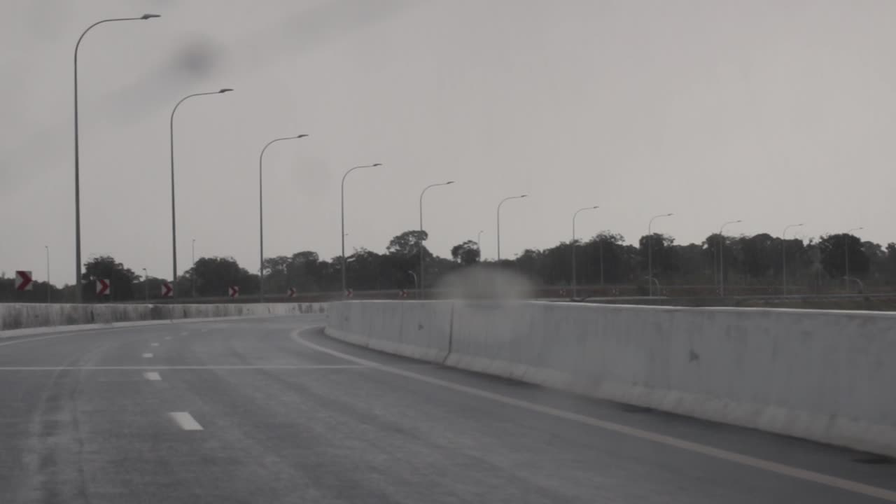 Rainy Day Drive on a Highway Curve