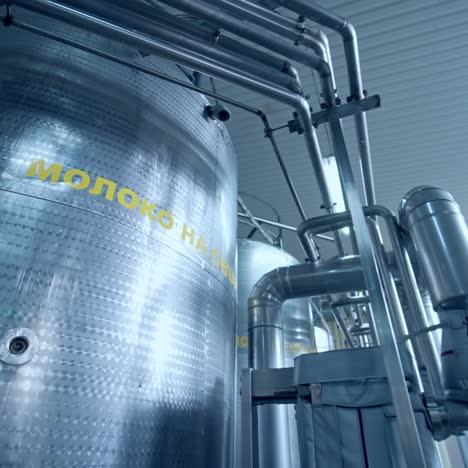 industrial dairy production factory. metallic stainless steel pipes in modern dairy plant