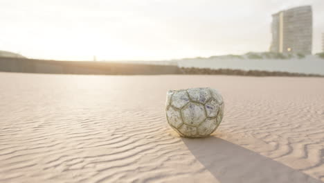 single ball on the beach with nobody