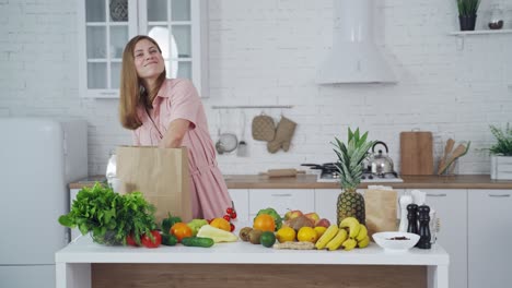 woman unpacking groceries in a kitchen