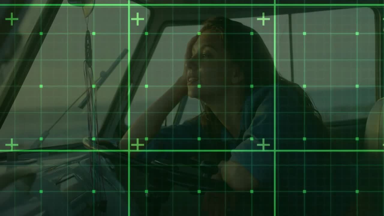Travel driver shifting and shielding eyes from sunlight at wheel while surveying sea horizon