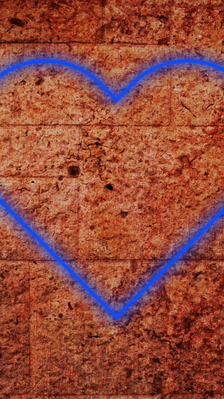 Insegna al neon a forma di cuore su muro di mattoni 4k