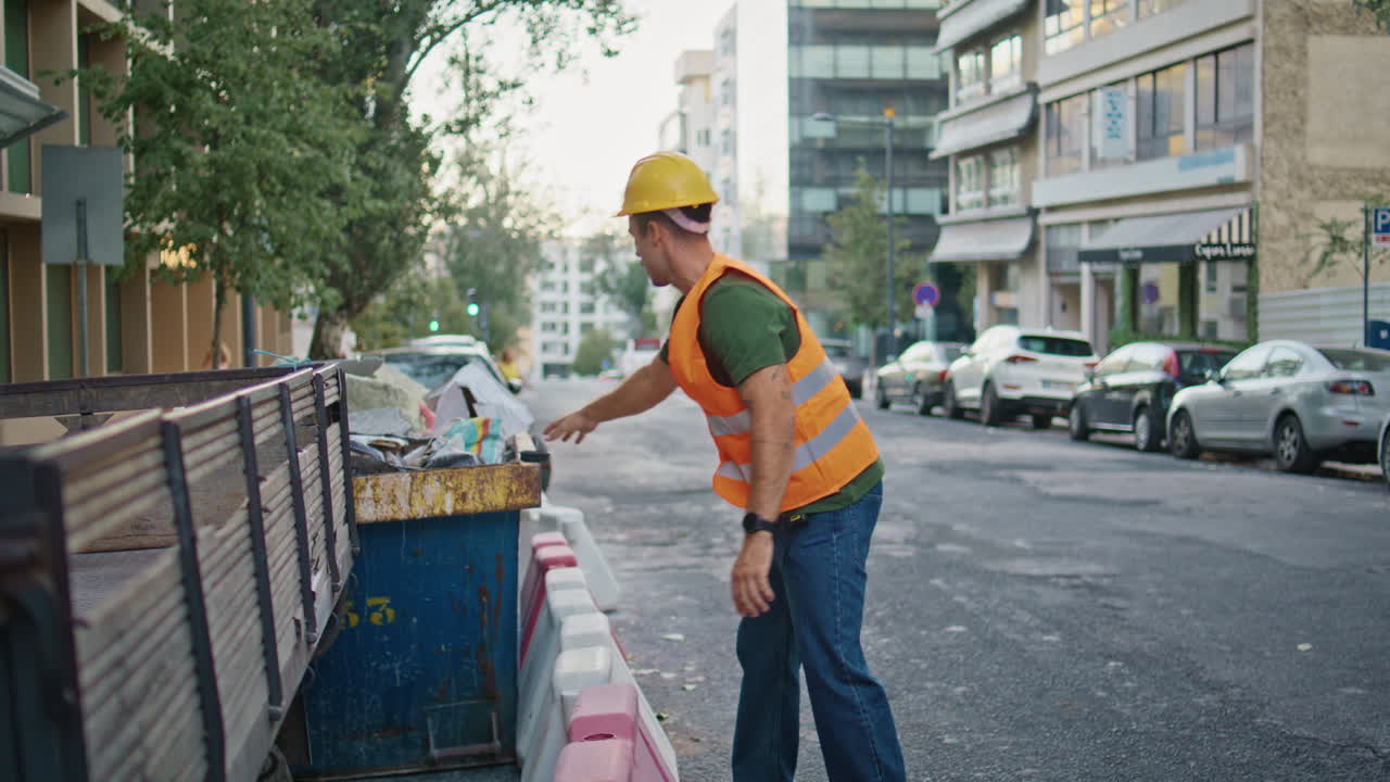 Urban foreman working street putting enclosure at morning town. Builder man