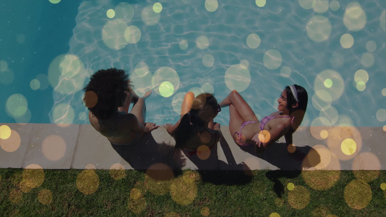 three women dipping legs in pool under sunlight, showing animated health charts and data icons