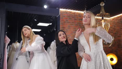 trying on wedding dresses