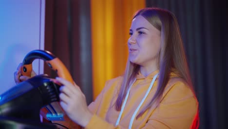 gamer girl playing video games. woman having fun while driving on car racing simulator
