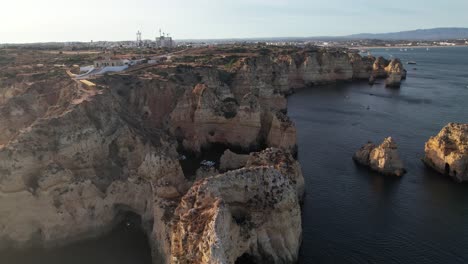 Aerial-view-of-Ponta-da-Piedade-rock-formations-in-Lagos,-Portugal