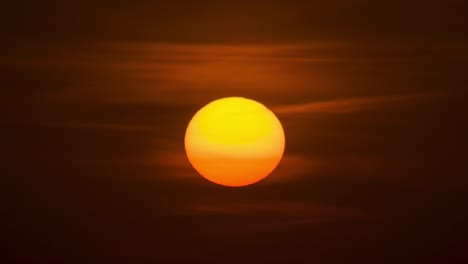 the bright sun on the cloud background. time lapse