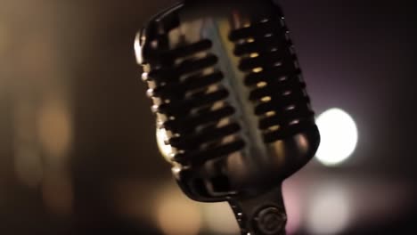 a close-up of a vintage microphone highlighted against a softly lit background, capturing the essence of music and performance in an intimate setting
