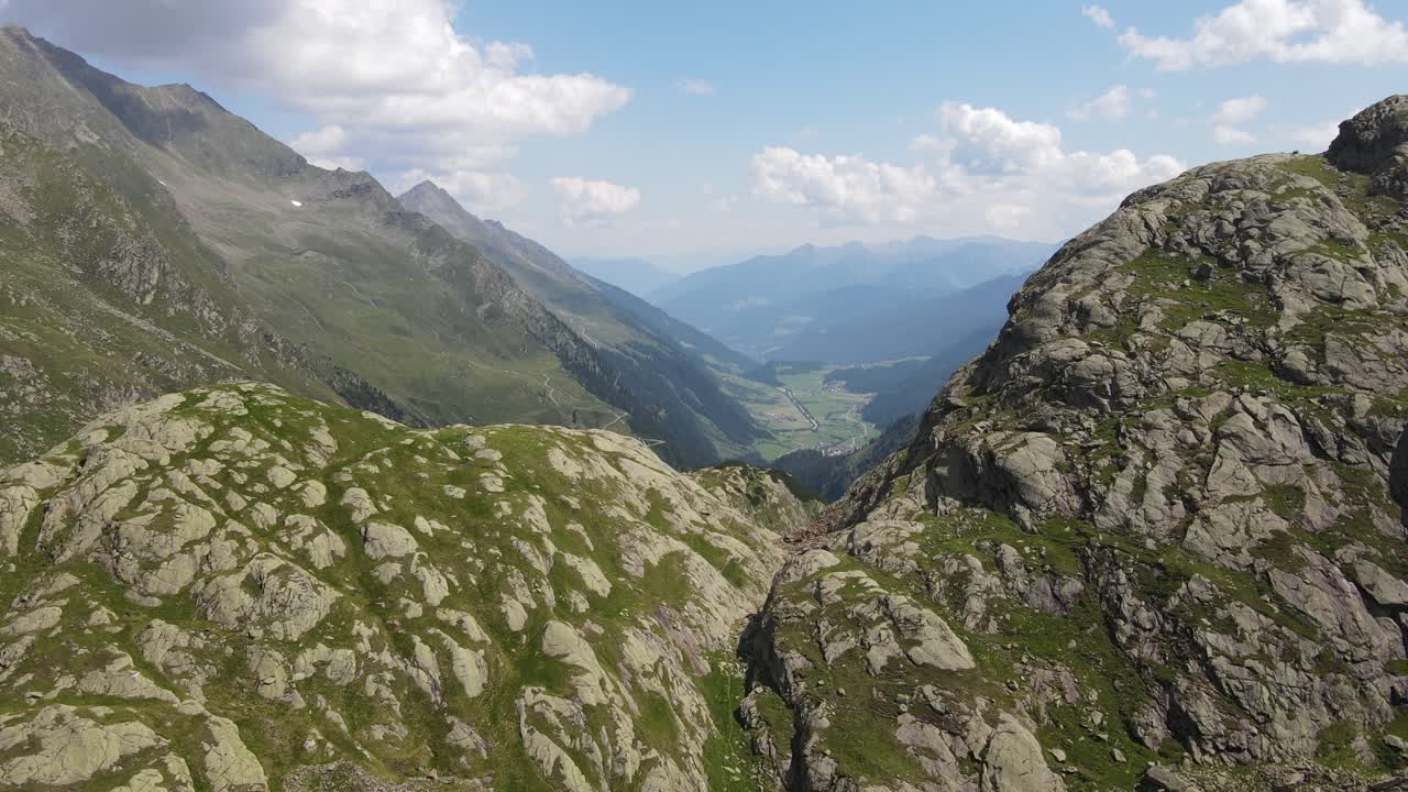 wide angle drone video of the beautiful mountains in northern Italy with the view over mountains and valleys. near the dolomites in South Tyrol.