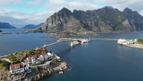 RV-Camper-drives-bridge-road-to-Henningsvaer-at-Lofoten-Island,-Norway---4k-Aerial