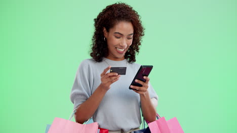 woman shopping online with credit card and mobile phone