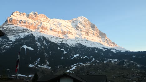 day-to-night timelapse of interlaken, switzerland with a snow-covered mountain in the background