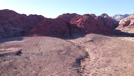 Cinematic-ascending-aerial-over-the-arid-landscape-of-the-Red-Rock-Desert-in-Nevada