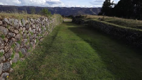 Old-Inca-Road-Traversing-Kusilluchayoc-and-the-Temple-of-the-Moon-in-Cusco,-Peru---Pan-Right-Shot