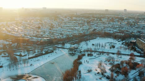 aerial - snowy winter over griftpark in utrecht, netherlands, wide shot