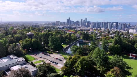 volunteer park with cityscape background in seattle, washington, united states. aerial drone shot
