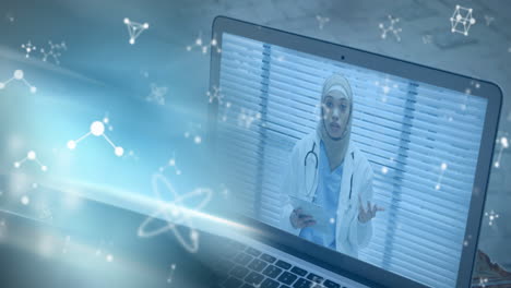 molecules moving over female doctor on laptop screen.