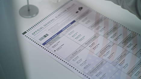 anonymous american male citizen votes for joe biden on paper bulletin close up of anonymous american male citizen filling out paper bulletin in voting booth african american man votes for joe biden at polling station national election day in united states civic duty