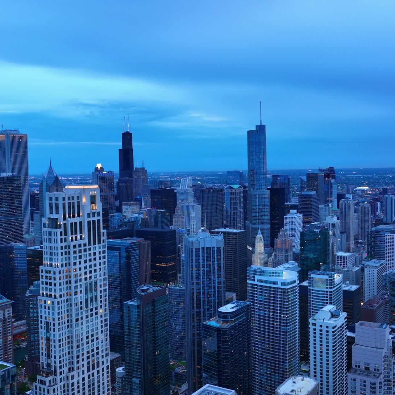 Panoramic view of Chicago colored blue. Amazing scenery of the city at dusk time from aerial perspective