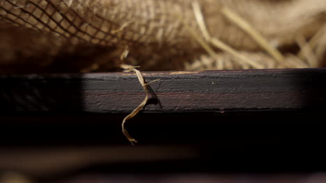 Close-up-of-a-wooden-manger-revealing-light