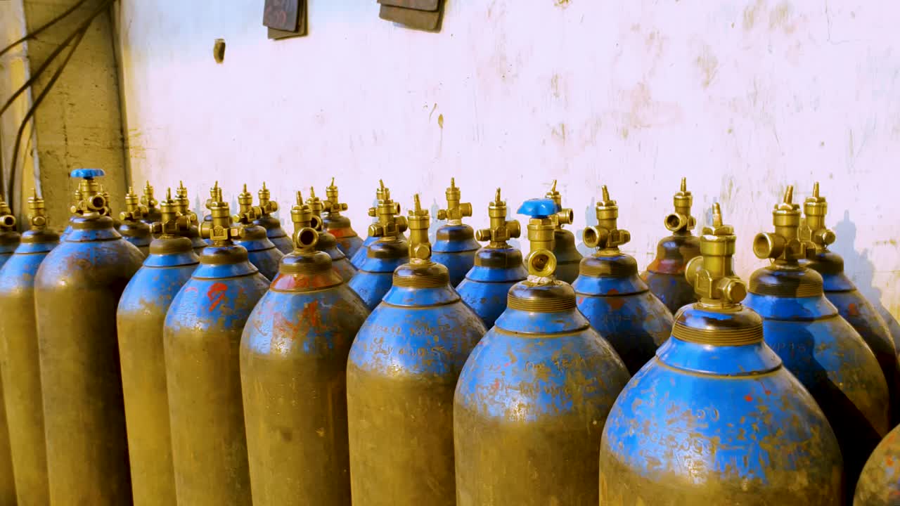 Stock of empty blue oxygen cylinders for industry