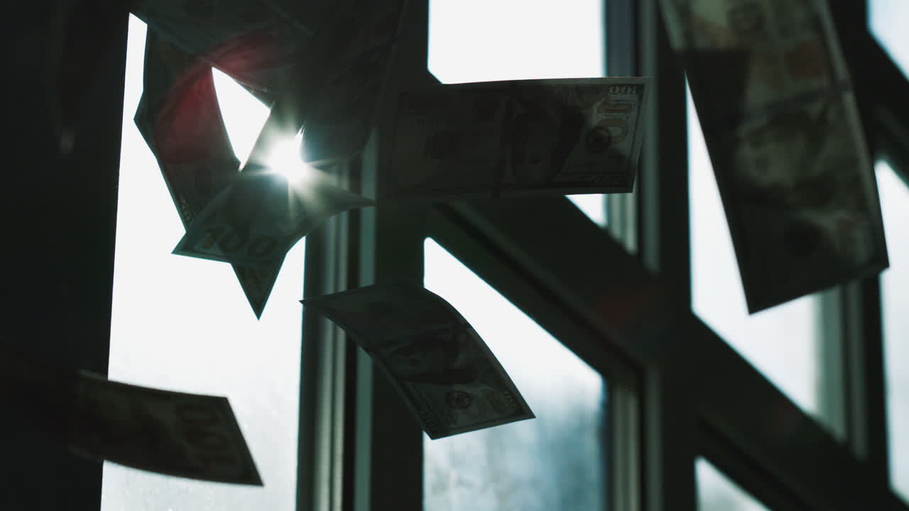 dinero colgando de una ventana