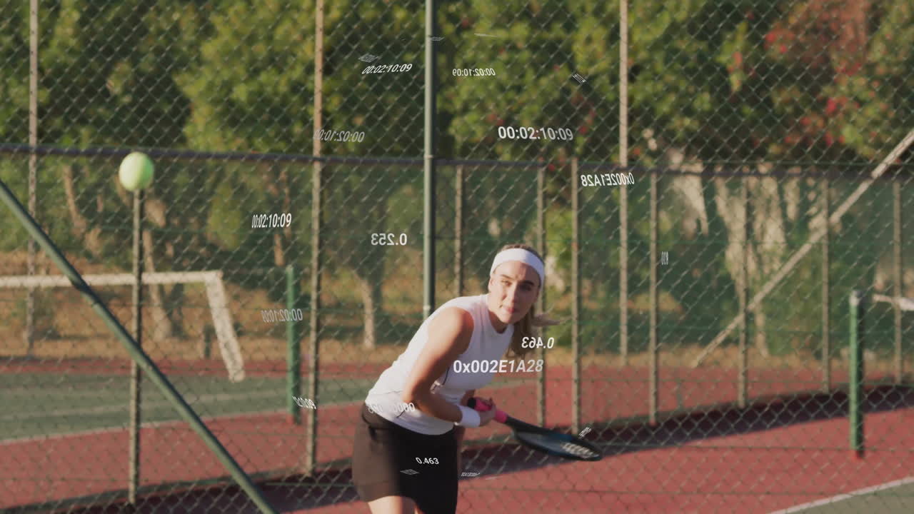 woman swinging tennis racket on clay court for technology presentation, with timecode overlays