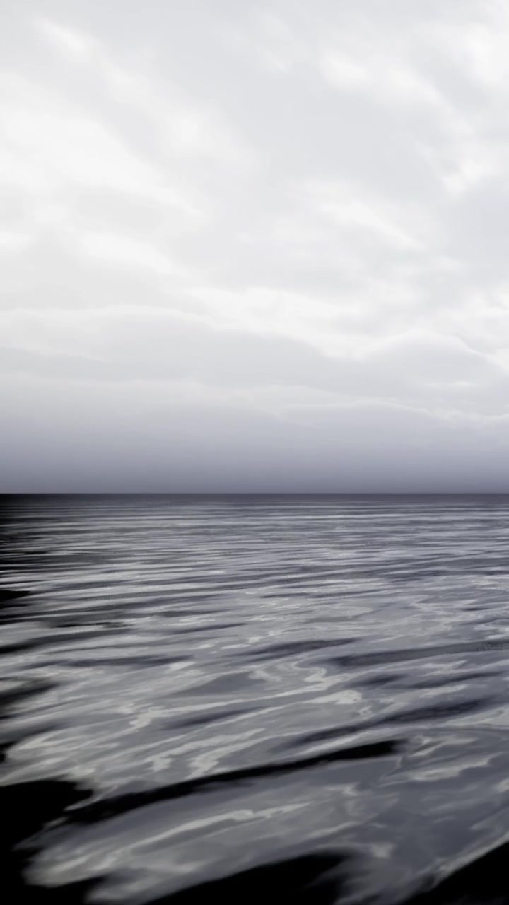 View of the calm water under gray clouds in an open area near the coast