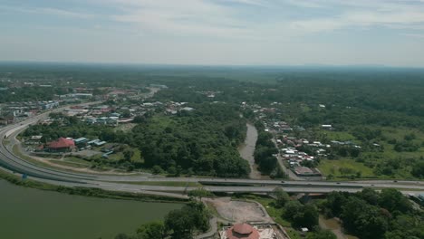 aerial drone view, serian district town ,summer with beautiful green trees,new building and water park lake, water from the mountain sarawak,borneo.