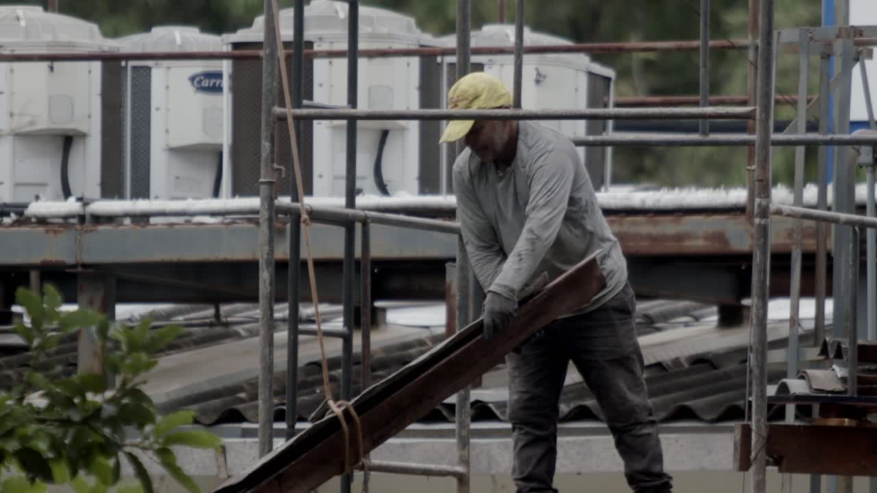 Construction occupational lifestyle, scaffolding protection, slow-mo